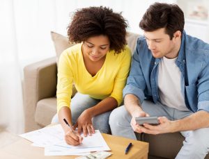 couple filling out financial paperwork