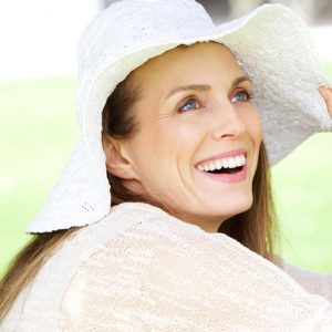 relaxed woman in hat